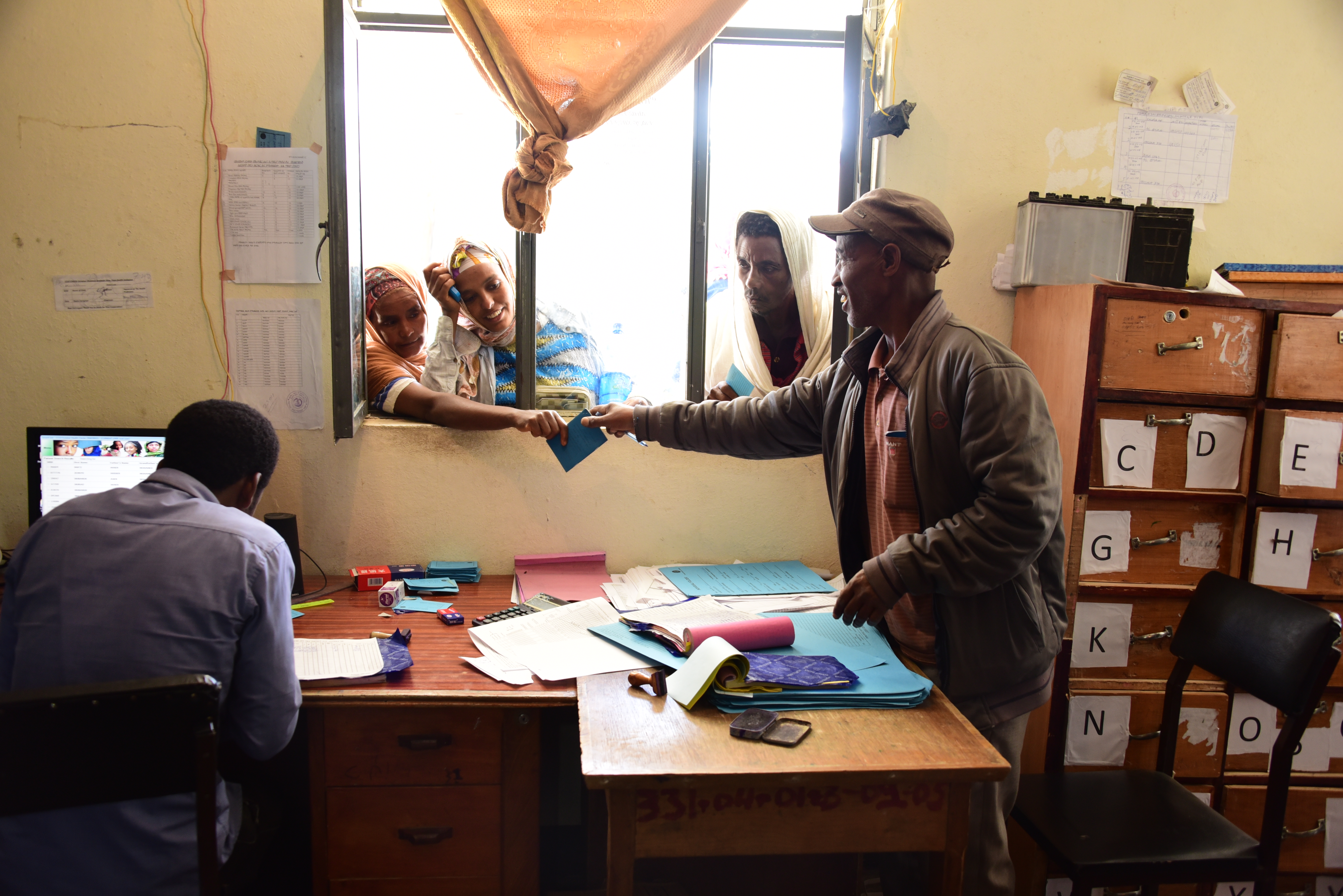 CBHI beneficiaries at the card room window